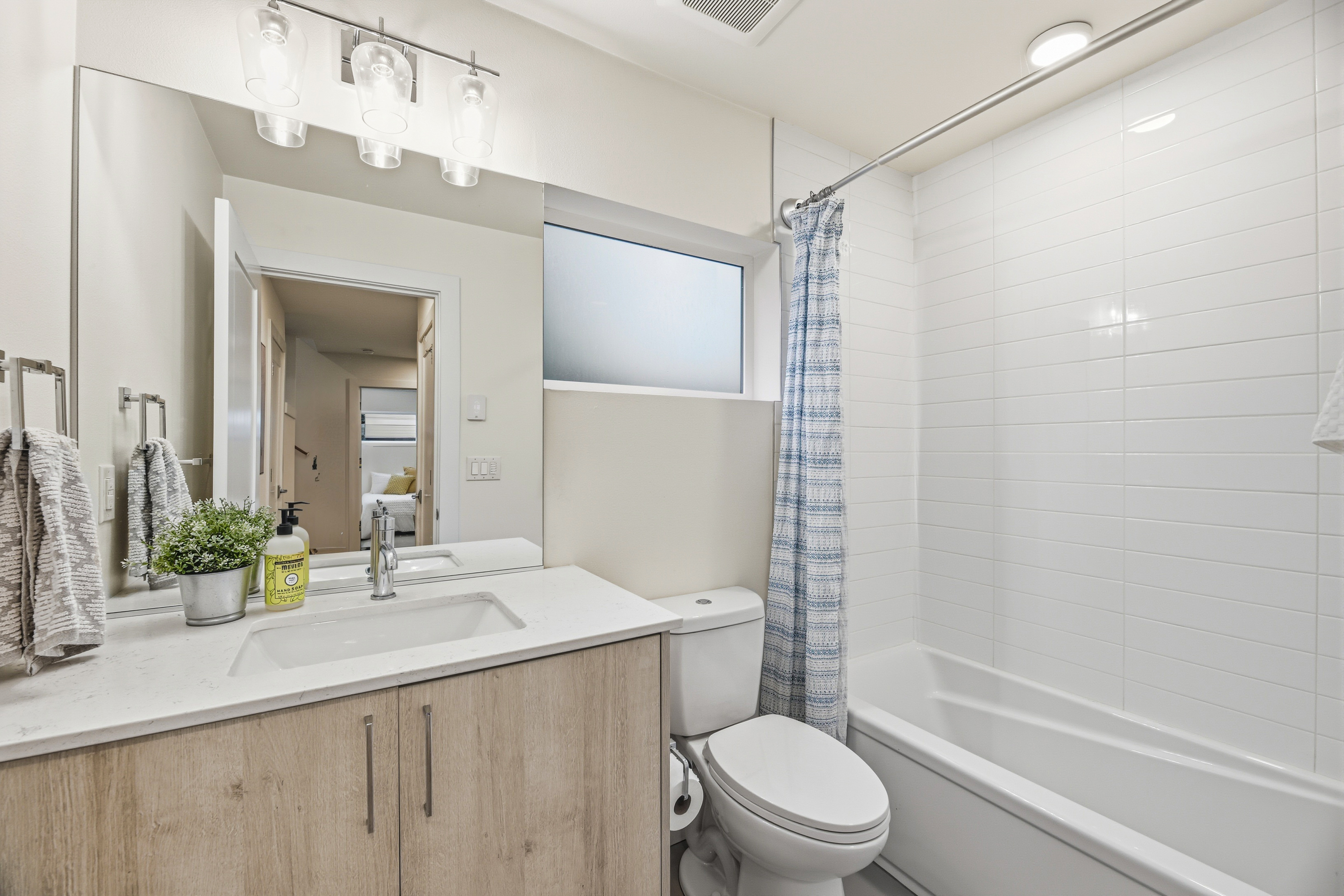 Clean modern bathroom with white subway tile
