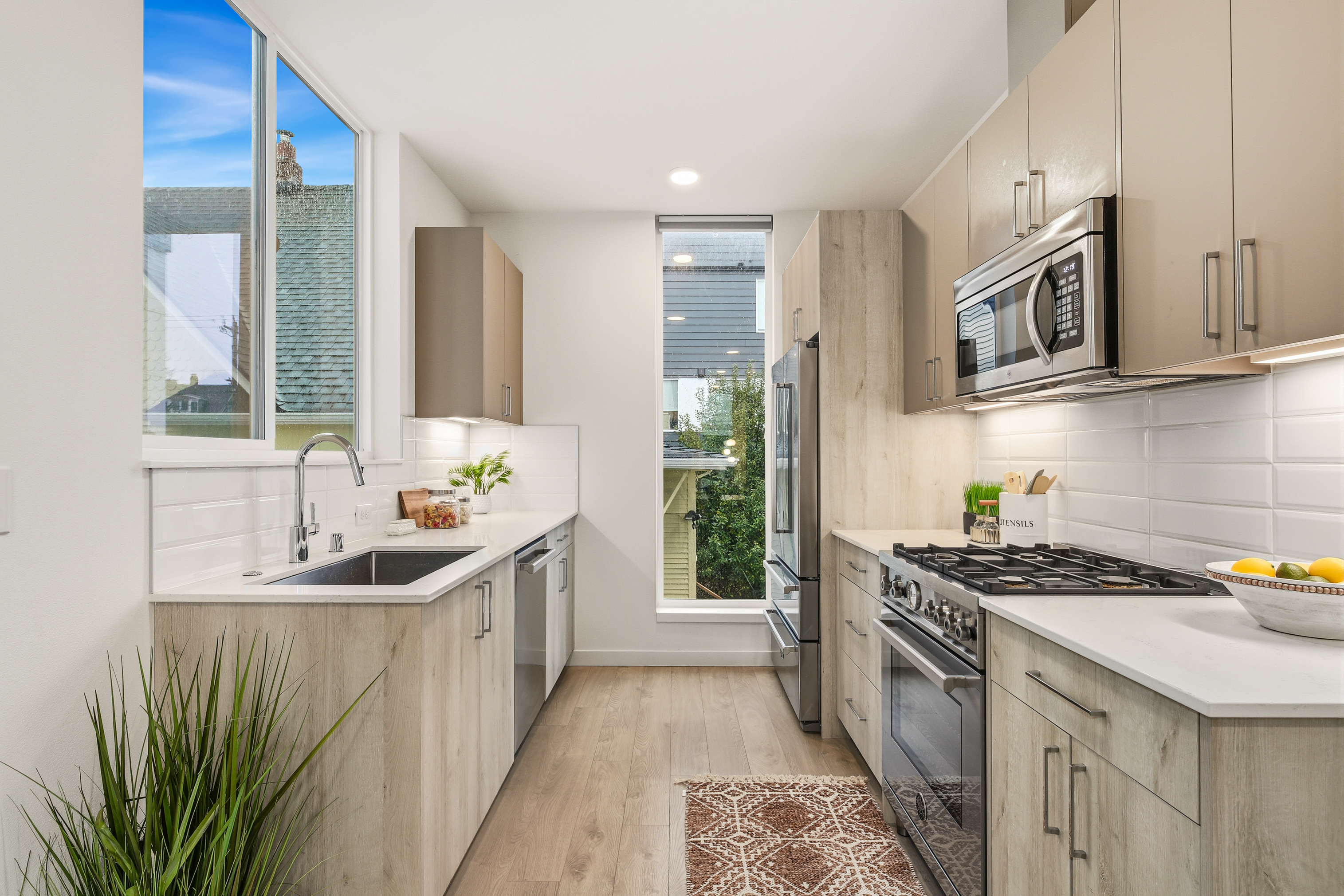 Modern kitchen with Bertazzoni appliances and white countertops